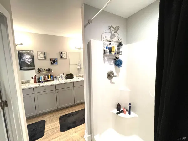 a kitchen with a sink dishwasher and a refrigerator with cabinets