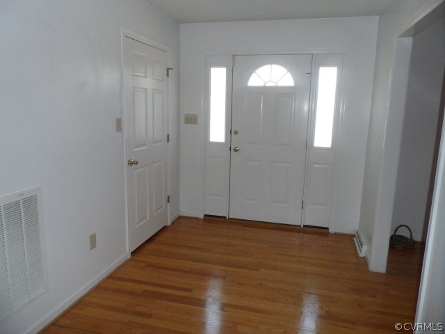 1272 Tuggle Road Farmville, VA 23901 - Photo 3 of 17 a view of empty room with wooden floor and fan