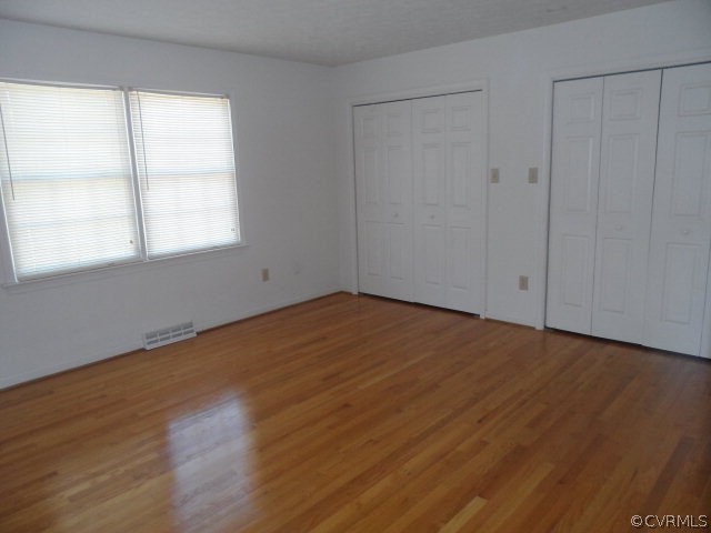 1272 Tuggle Road Farmville, VA 23901 - Photo 10 of 17 a view of empty room with wooden floor and fan