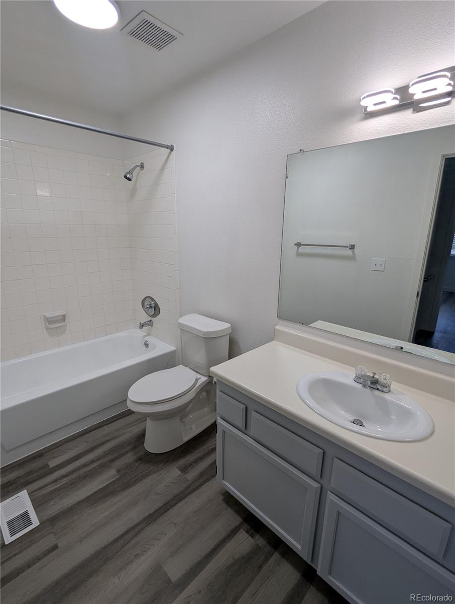 444 Spring Grove Avenue Highlands Ranch, CO 80126 - Photo 15 of 21 a bathroom with a sink and a mirror