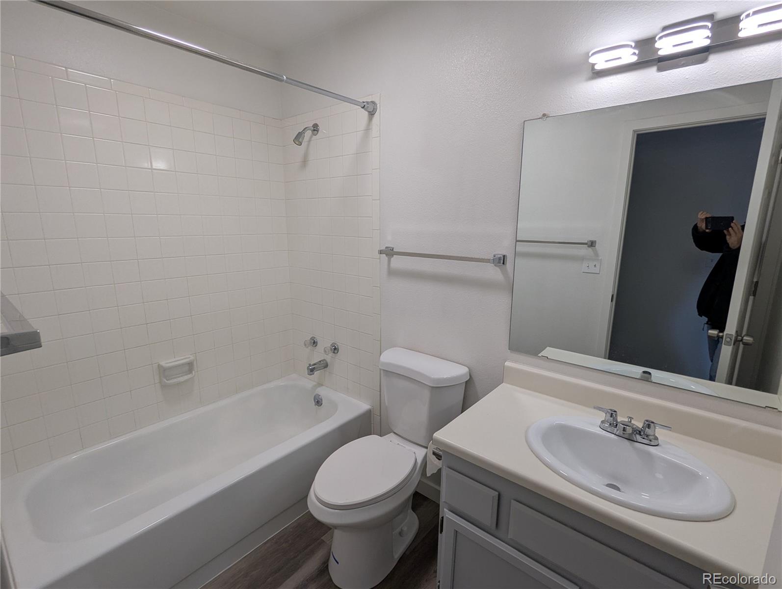 444 Spring Grove Avenue Highlands Ranch, CO 80126 - Photo 8 of 21 a bathroom with a sink toilet vanity and shower