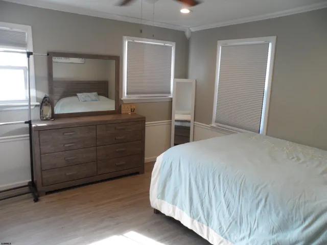 a bedroom with a bed and walk in closet
