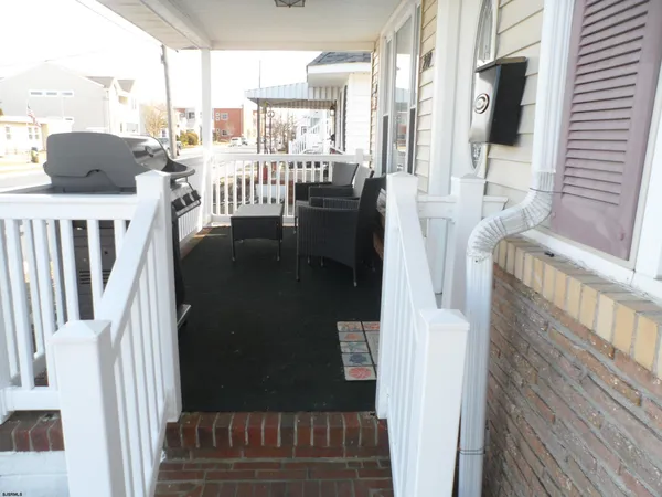 a view of a balcony with furniture
