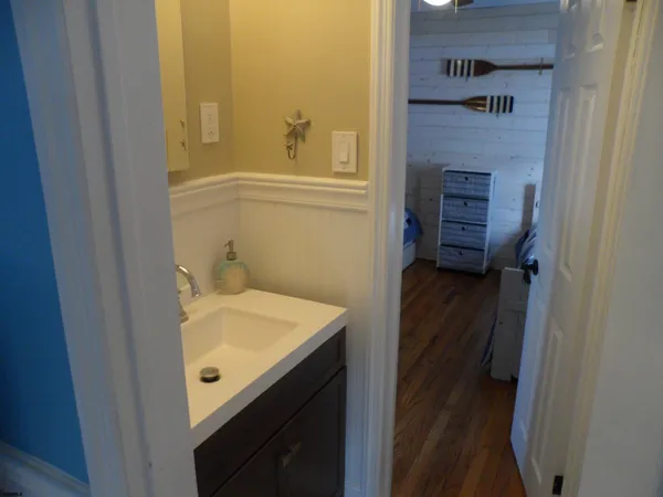 a bathroom with a sink and a mirror