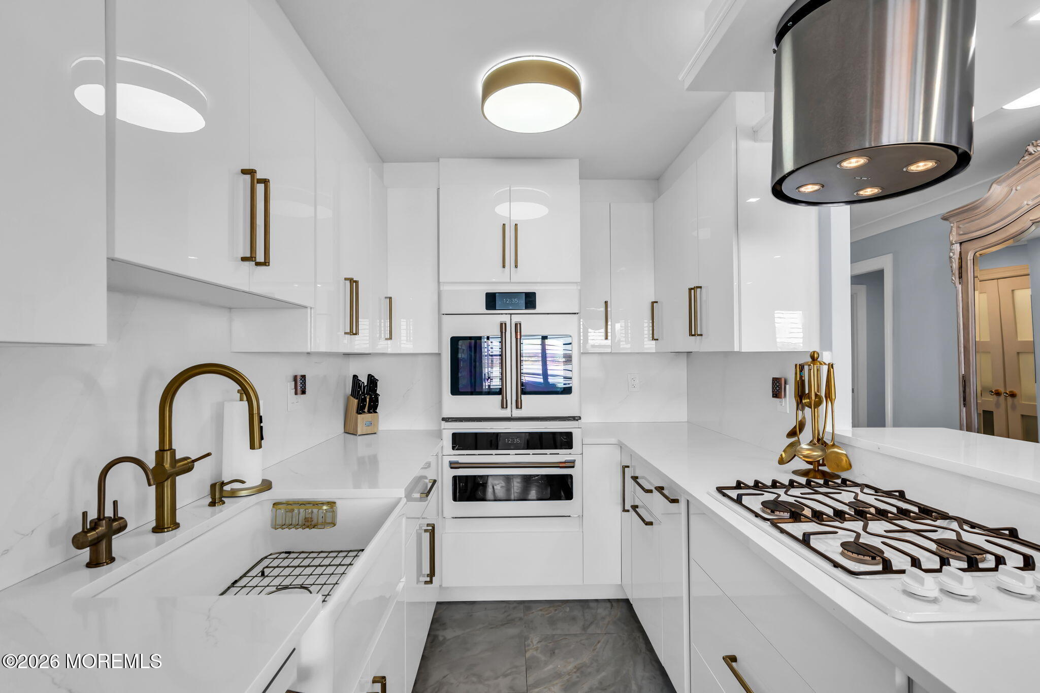 28 Riverside Avenue, Unit 1N Red Bank, NJ 07701 - Photo 17 of 40 a kitchen with stainless steel appliances a stove a sink and a refrigerator