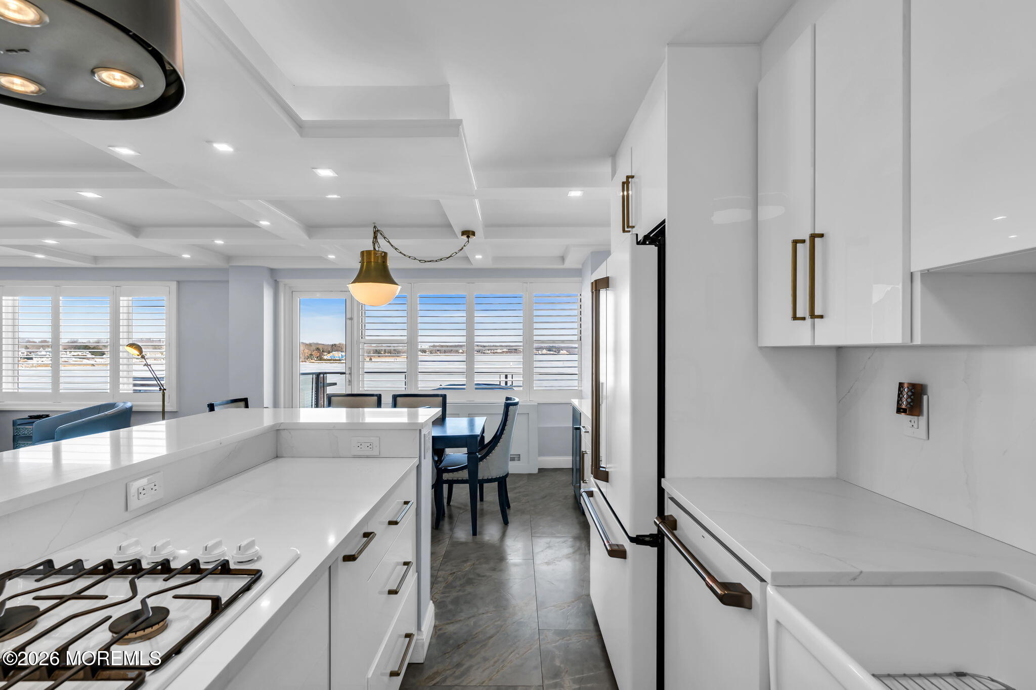 28 Riverside Avenue, Unit 1N Red Bank, NJ 07701 - Photo 18 of 40 a kitchen with stainless steel appliances granite countertop a sink a stove and a wooden floors