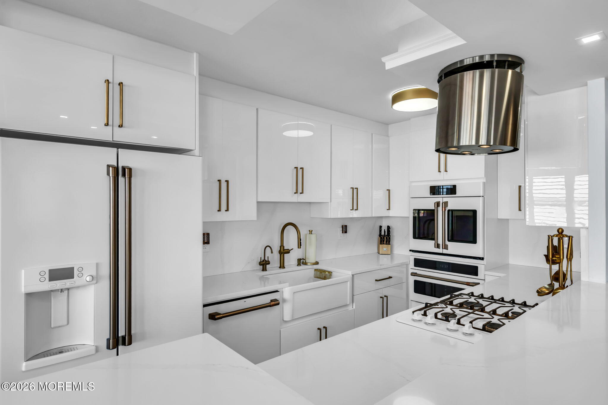 28 Riverside Avenue, Unit 1N Red Bank, NJ 07701 - Photo 19 of 40 a kitchen with stainless steel appliances a sink a stove a refrigerator cabinets and a window