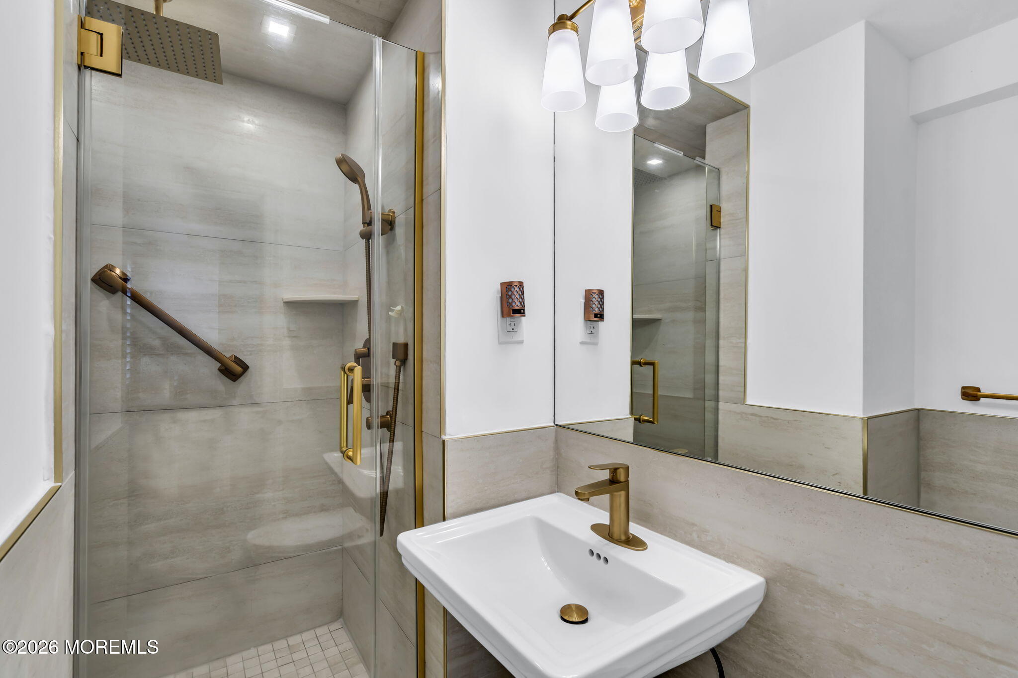 28 Riverside Avenue, Unit 1N Red Bank, NJ 07701 - Photo 22 of 40 a bathroom with a sink a mirror and shower