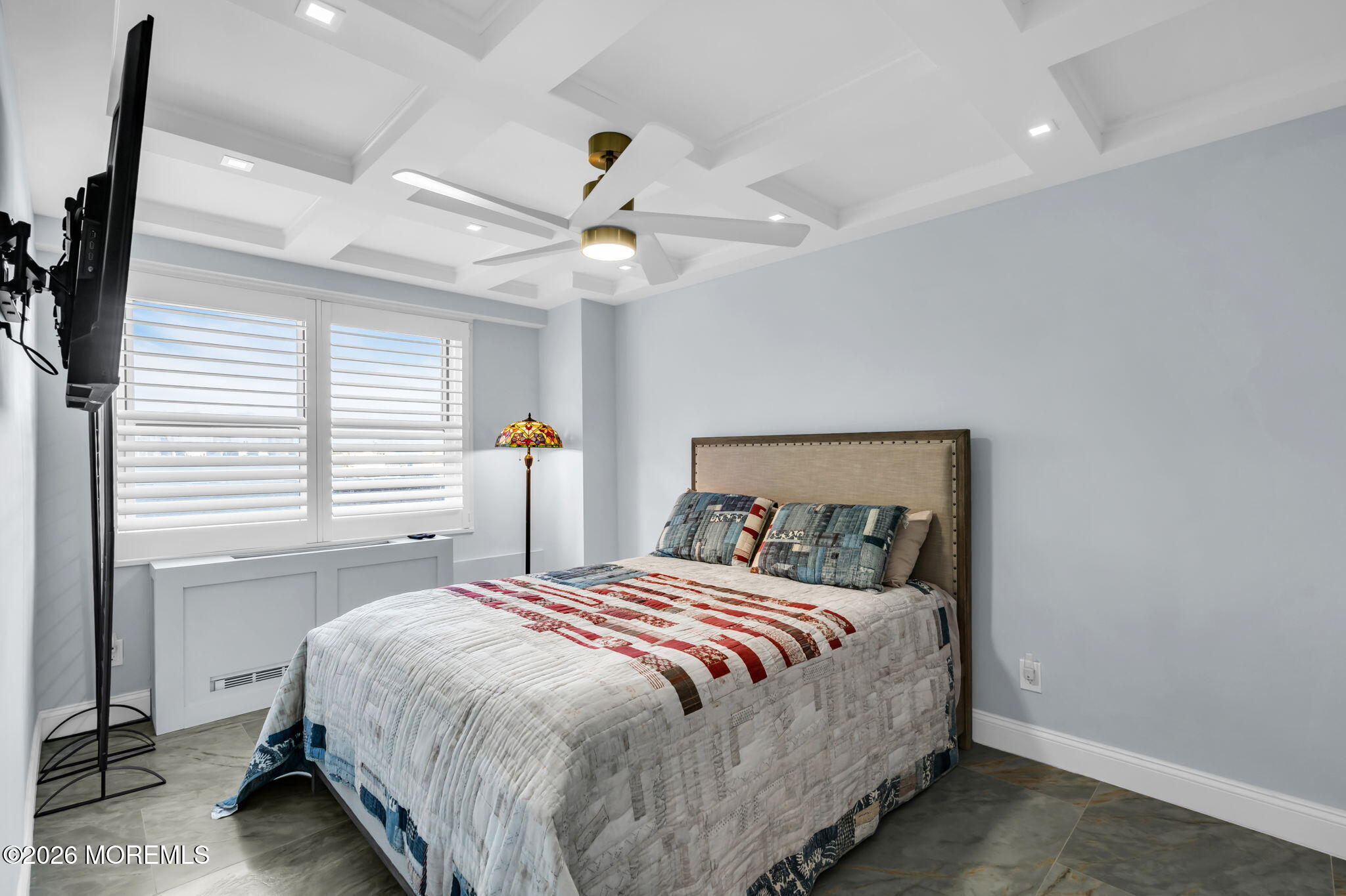 28 Riverside Avenue, Unit 1N Red Bank, NJ 07701 - Photo 23 of 40 a bedroom with a large bed and a chandelier