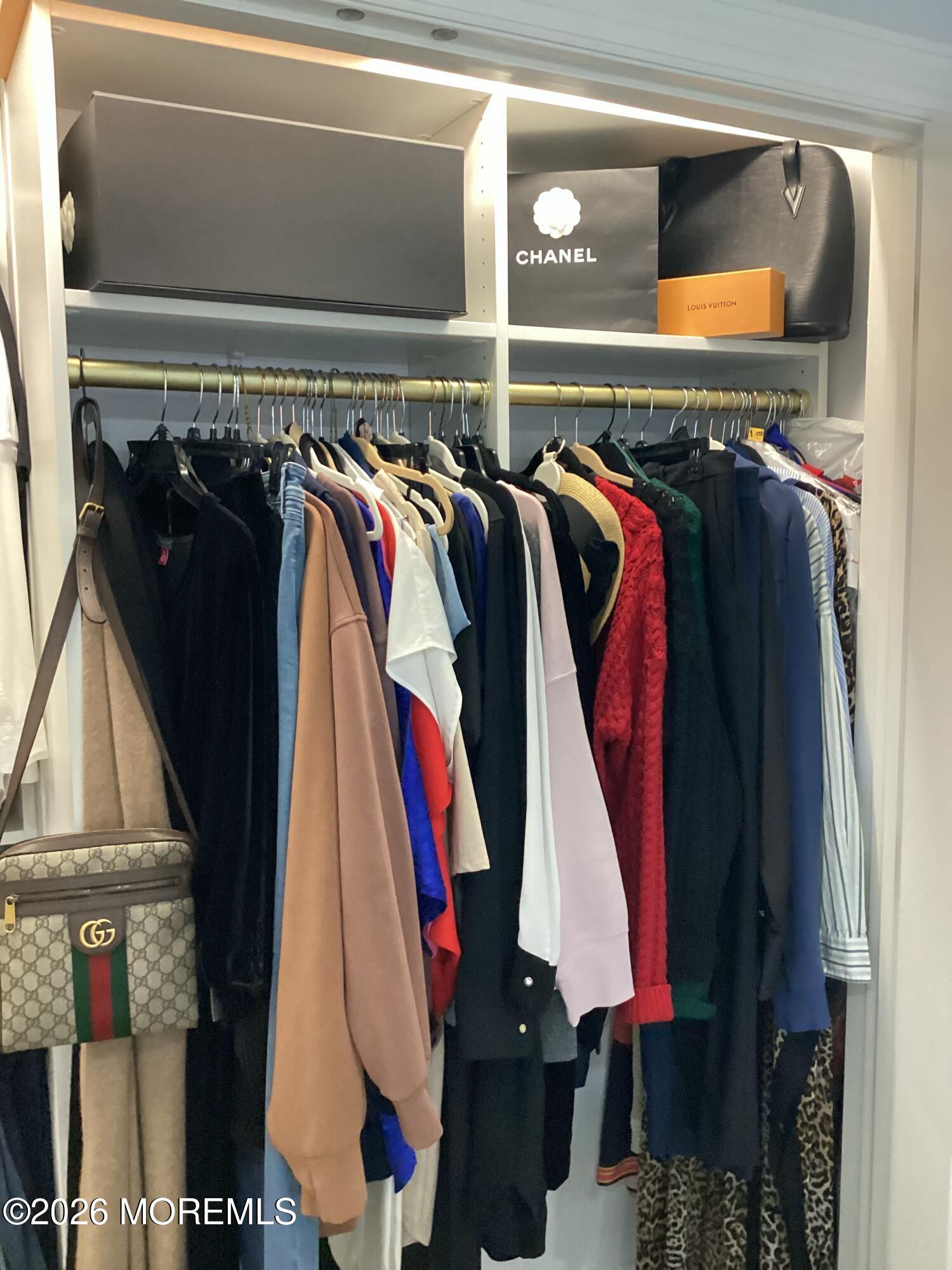 28 Riverside Avenue, Unit 1N Red Bank, NJ 07701 - Photo 32 of 40 a view of walk in closet with clothes and shoes