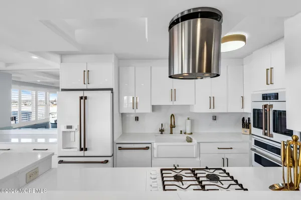 a bathroom with a sink a mirror and shower