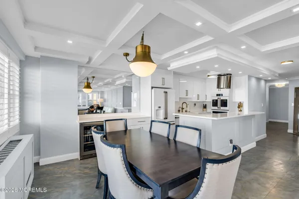 a kitchen with stainless steel appliances a refrigerator stove and sink