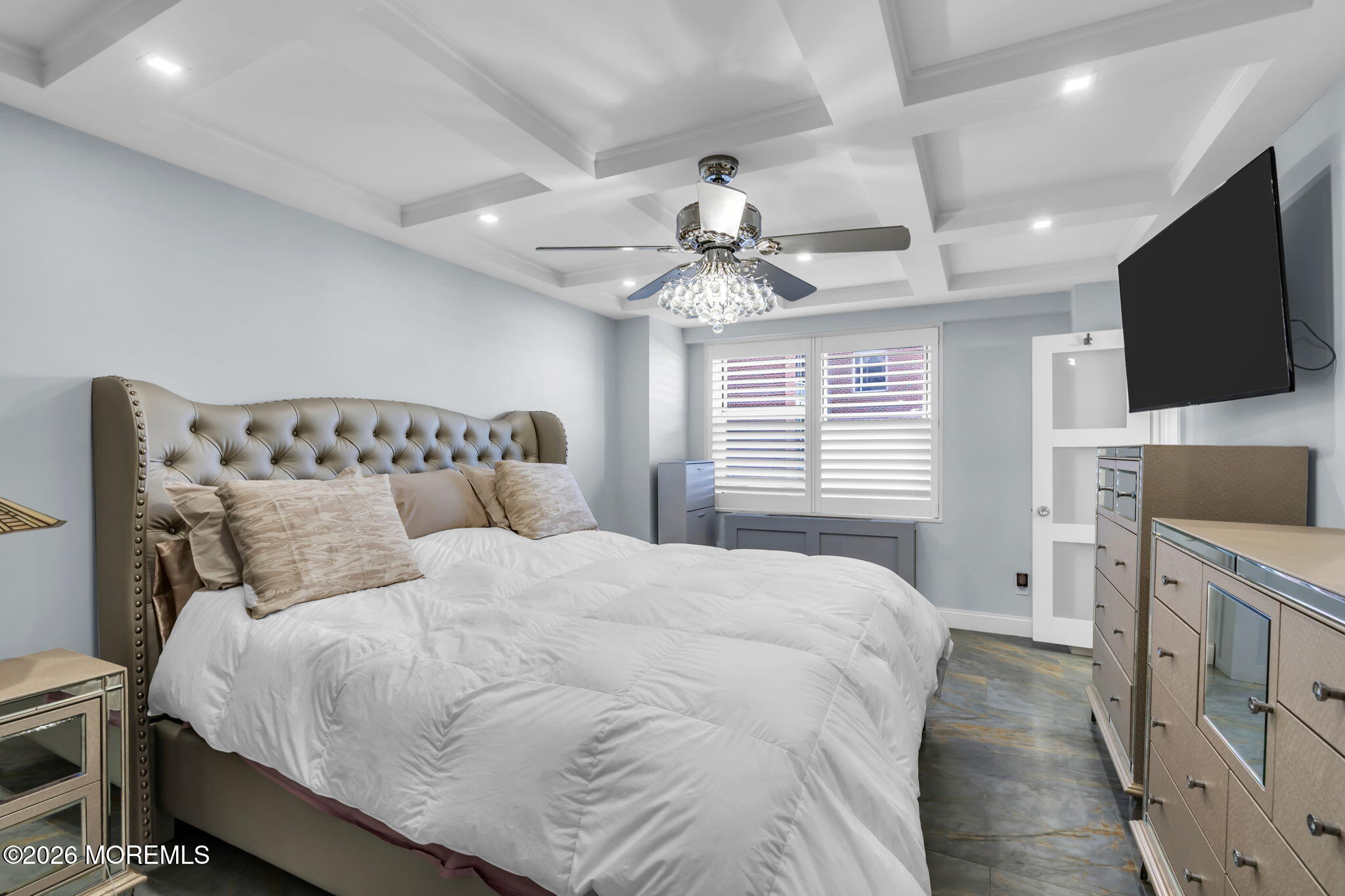 28 Riverside Avenue, Unit 1N Red Bank, NJ 07701 - Photo 8 of 40 a large bedroom with a bed and a flat screen tv