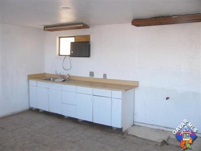 8433 Aspen Road Apple Valley, CA 92308 - Photo 4 of 5 a bathroom with a sink and a mirror