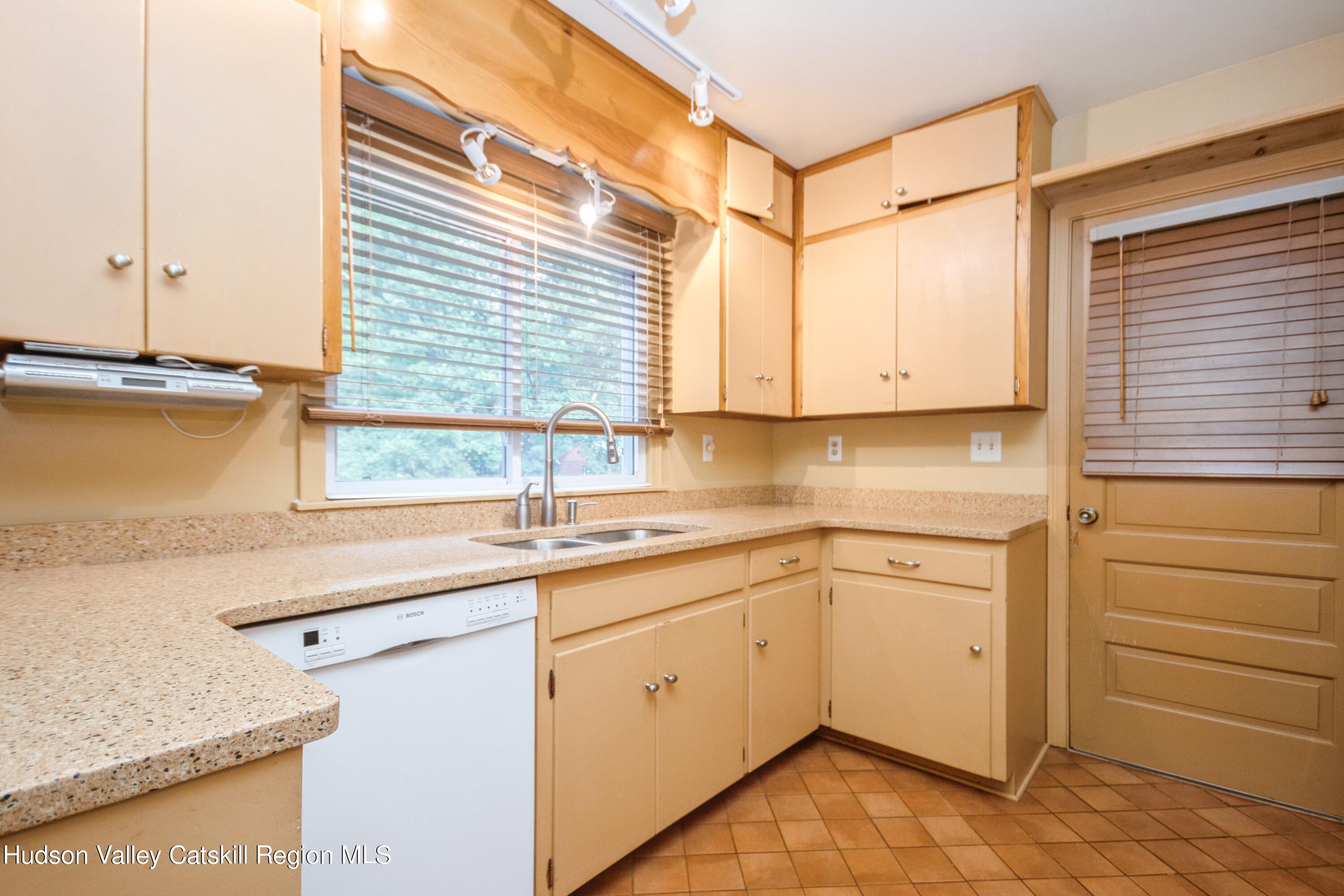 3754 Atwood Road Stone Ridge, NY 12484 - Photo 17 of 36 a kitchen with a sink cabinets and window