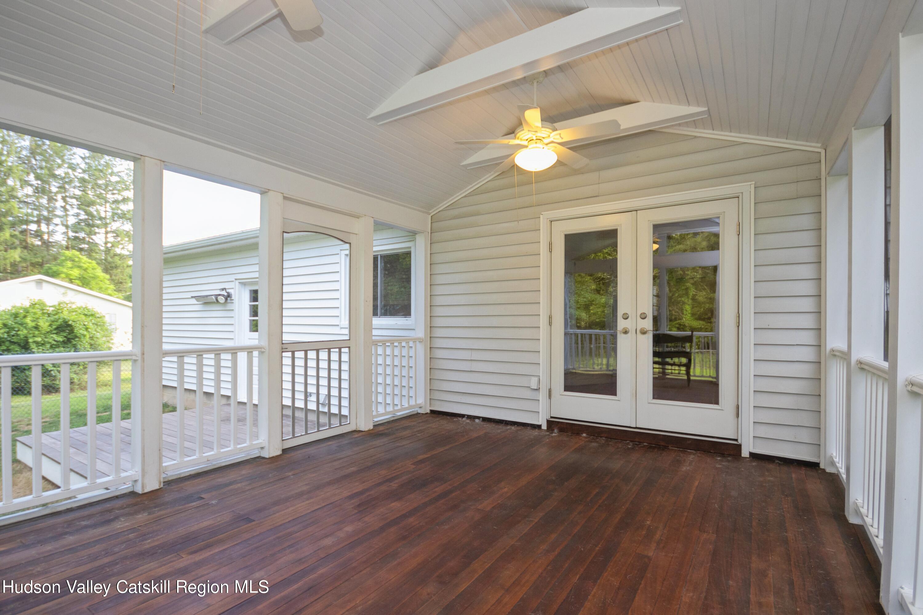 3754 Atwood Road Stone Ridge, NY 12484 - Photo 30 of 36 a view of an empty room with wooden floor and a window