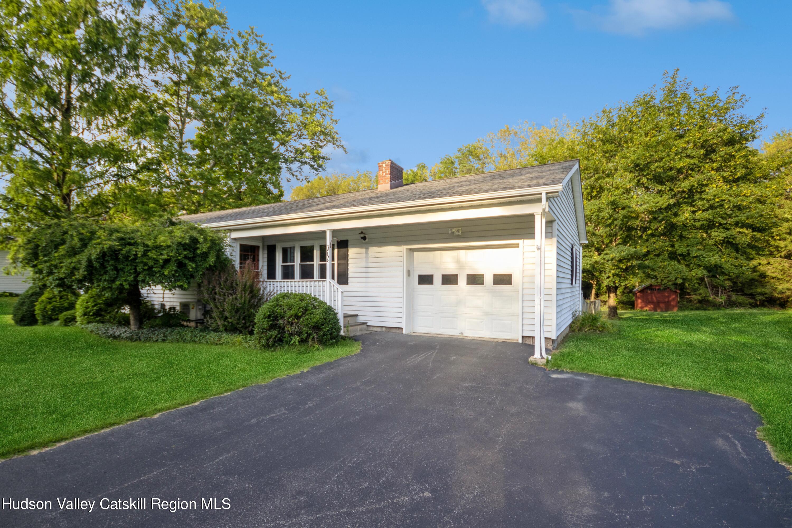 3754 Atwood Road Stone Ridge, NY 12484 - Photo 3 of 36 a view of a house with a yard and plants