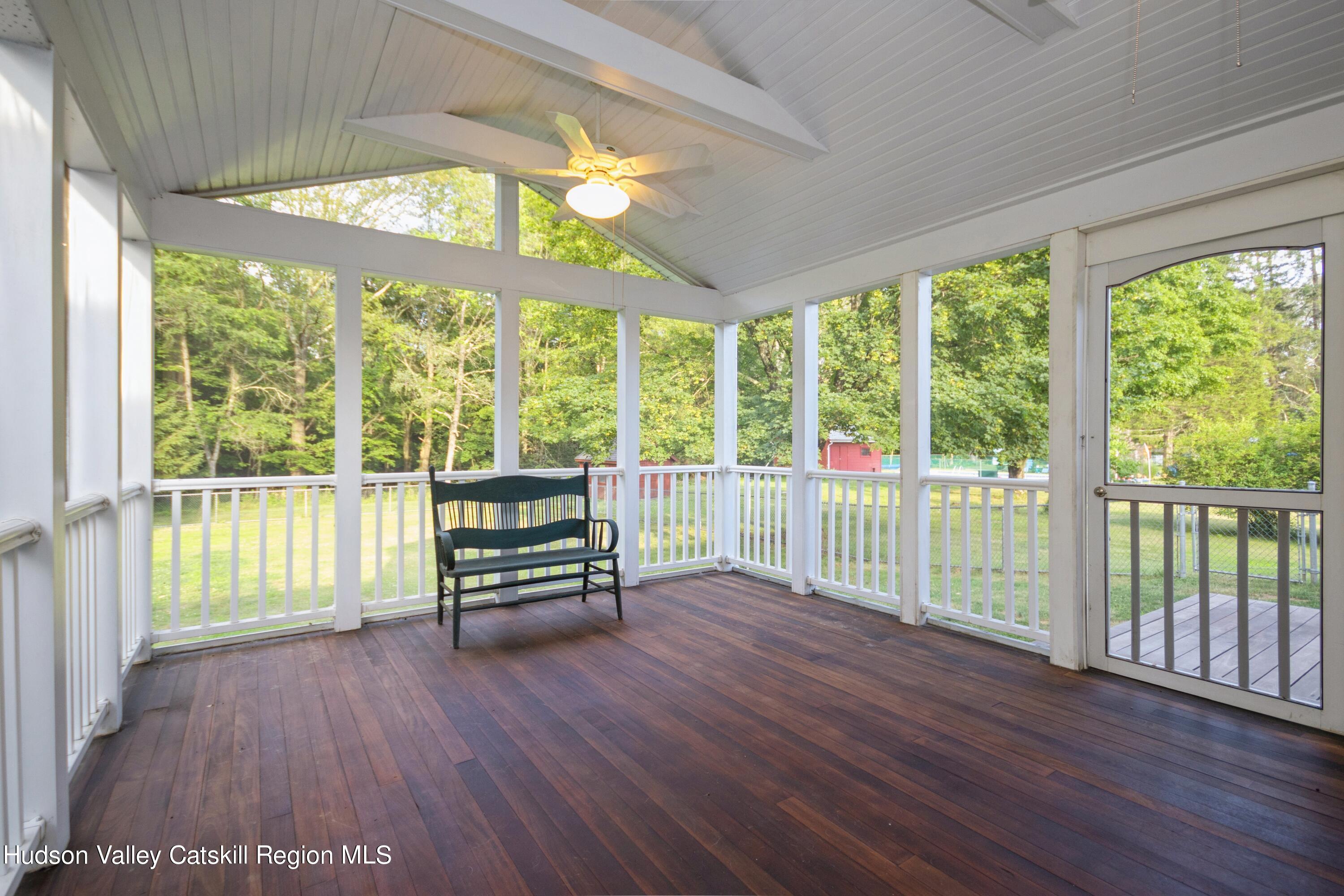 3754 Atwood Road Stone Ridge, NY 12484 - Photo 8 of 36 a living room with wooden floor and large windows