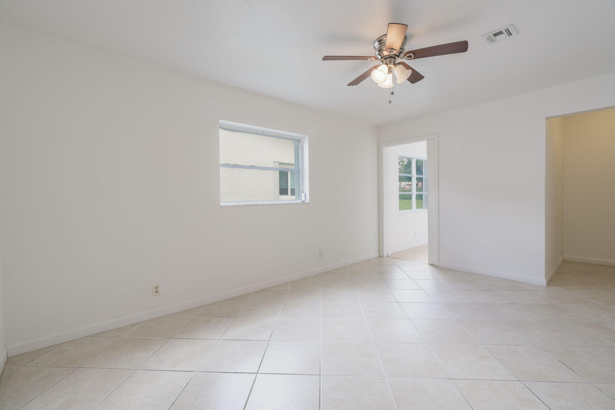 1141 Northwest 90th Way Plantation, FL 33322 - Photo 18 of 75 a view of an empty room with a ceiling fan and a ceiling fan