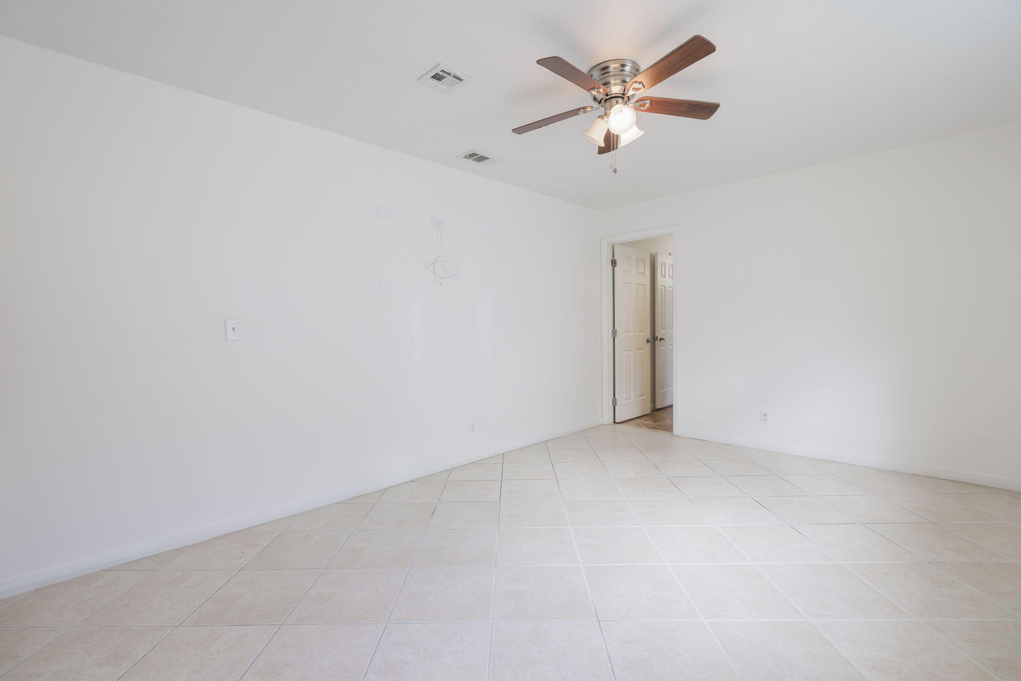 1141 Northwest 90th Way Plantation, FL 33322 - Photo 20 of 75 an empty room with closet and a ceiling fan