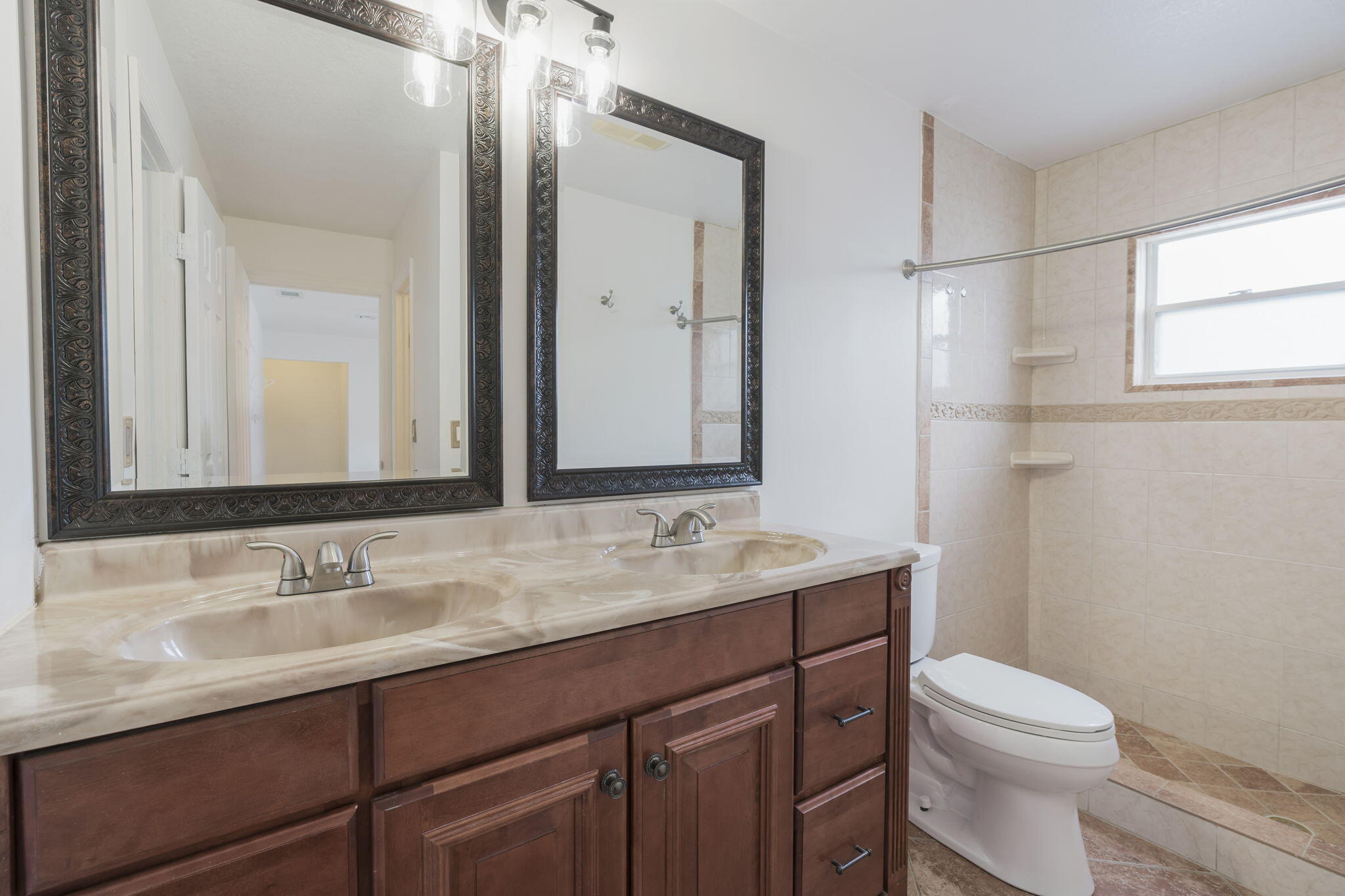 1141 Northwest 90th Way Plantation, FL 33322 - Photo 27 of 75 a bathroom with a granite countertop sink toilet a large mirror and a shower