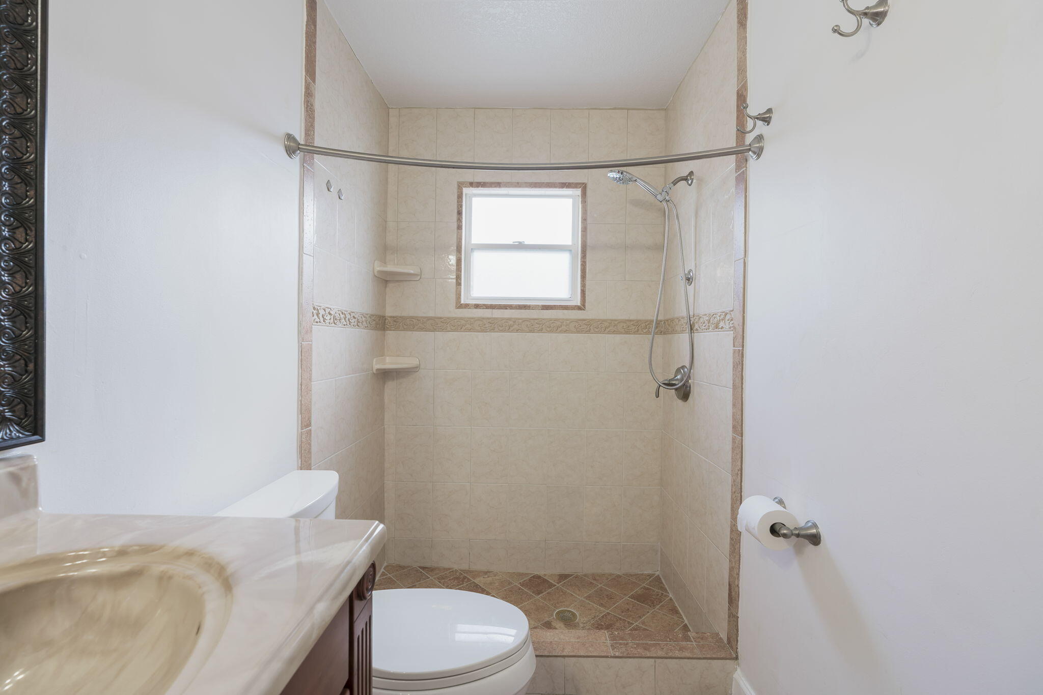 1141 Northwest 90th Way Plantation, FL 33322 - Photo 28 of 75 a bathroom with a sink a toilet a shower and a window