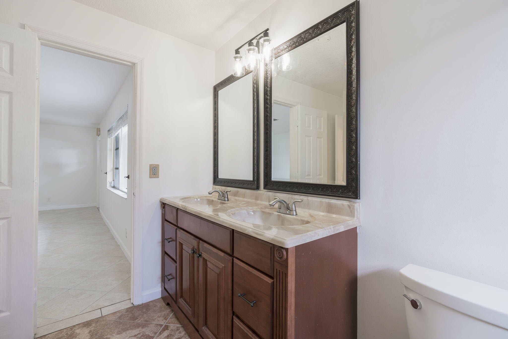 1141 Northwest 90th Way Plantation, FL 33322 - Photo 29 of 75 a bathroom with a sink and a mirror