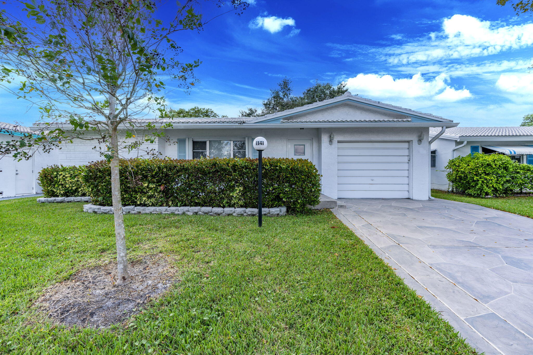 1141 Northwest 90th Way Plantation, FL 33322 - Photo 3 of 75 a house view with a garden space
