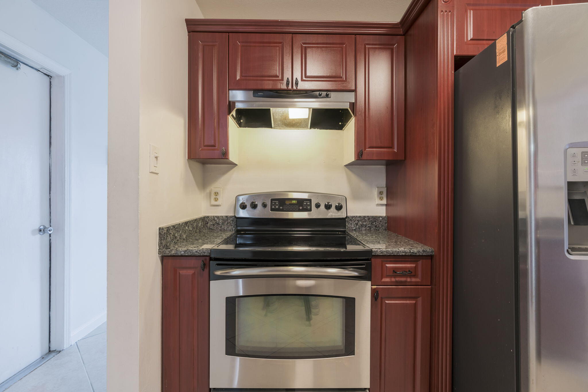 1141 Northwest 90th Way Plantation, FL 33322 - Photo 42 of 75 a stove top oven sitting inside of a kitchen