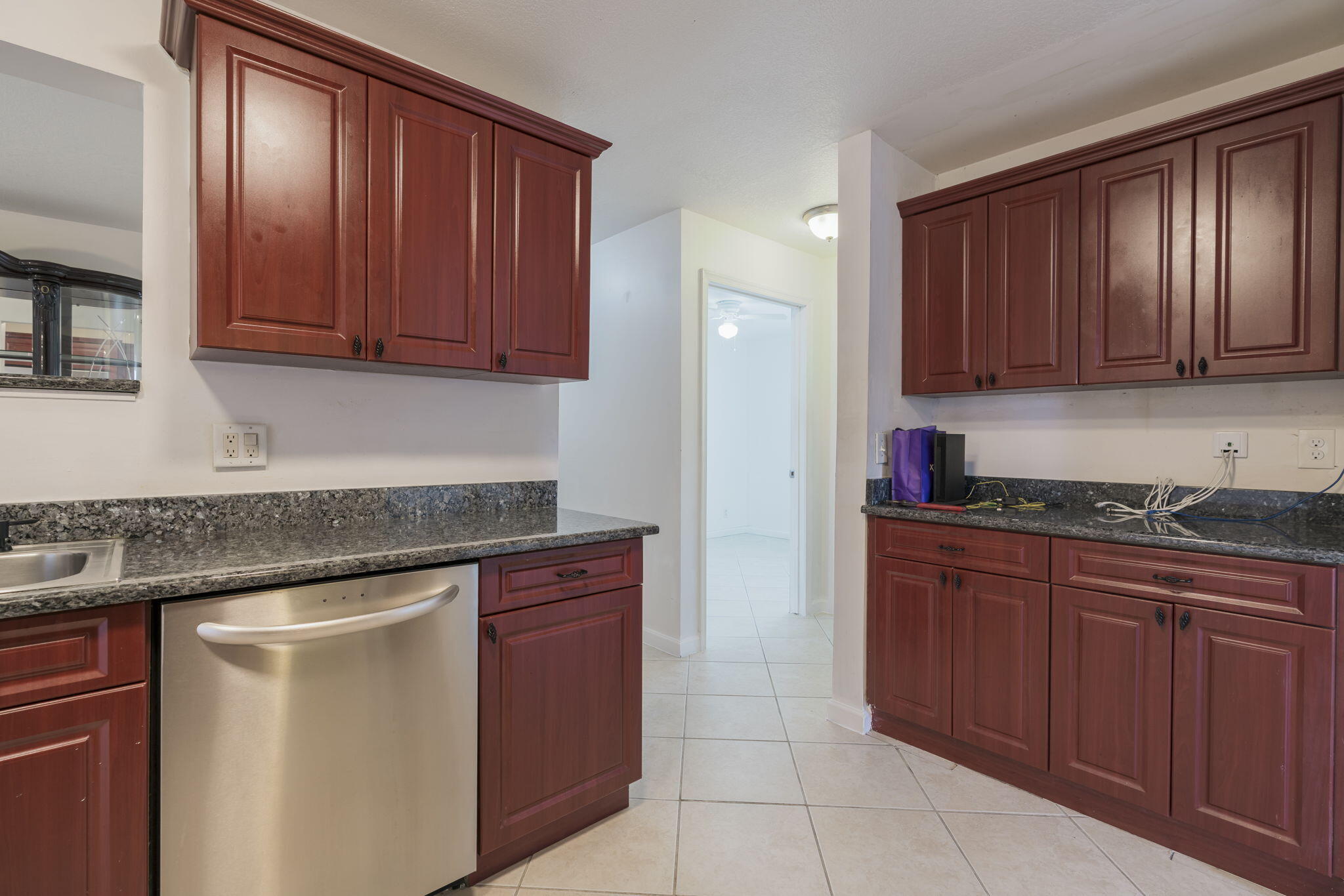 1141 Northwest 90th Way Plantation, FL 33322 - Photo 43 of 75 a kitchen with stainless steel appliances granite countertop wooden cabinets a sink and dishwasher