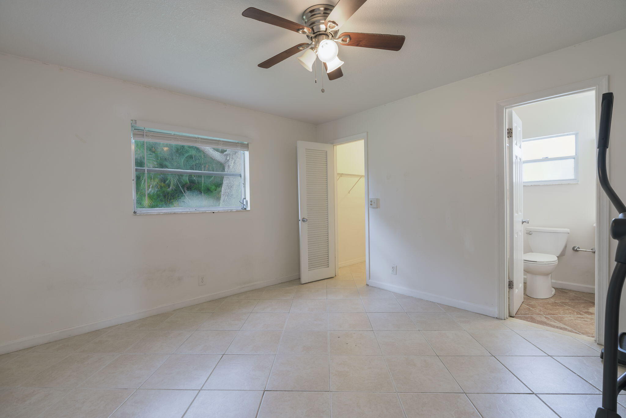 1141 Northwest 90th Way Plantation, FL 33322 - Photo 44 of 75 a view of an empty room with a fan