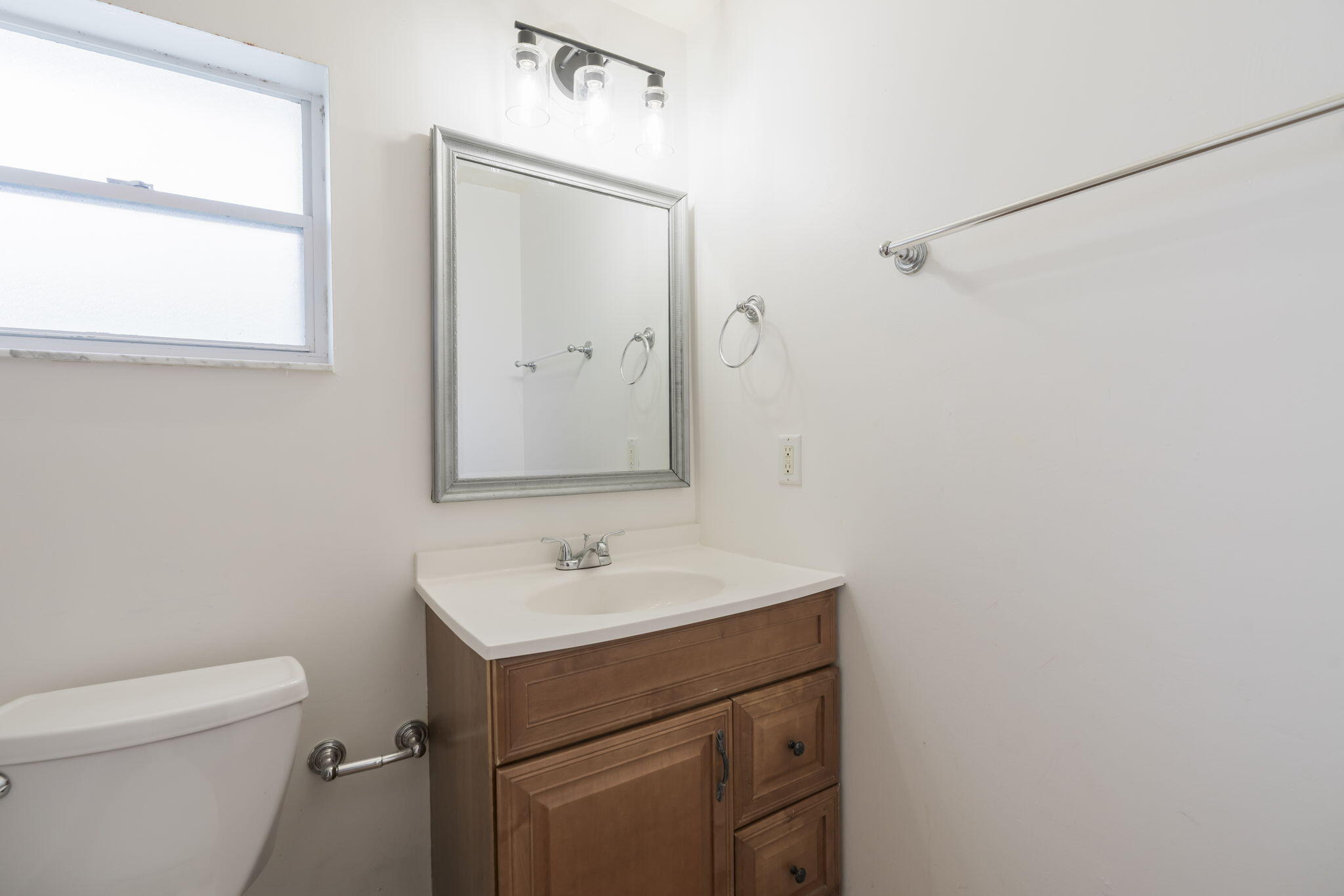 1141 Northwest 90th Way Plantation, FL 33322 - Photo 47 of 75 a bathroom with a sink a toilet and a mirror