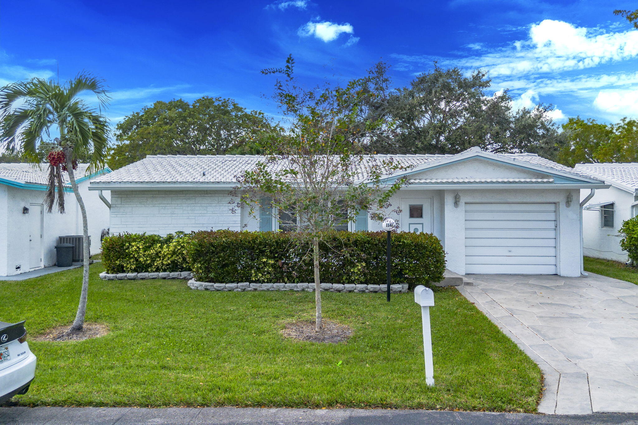 1141 Northwest 90th Way Plantation, FL 33322 - Photo 56 of 75 a front view of a house with a yard