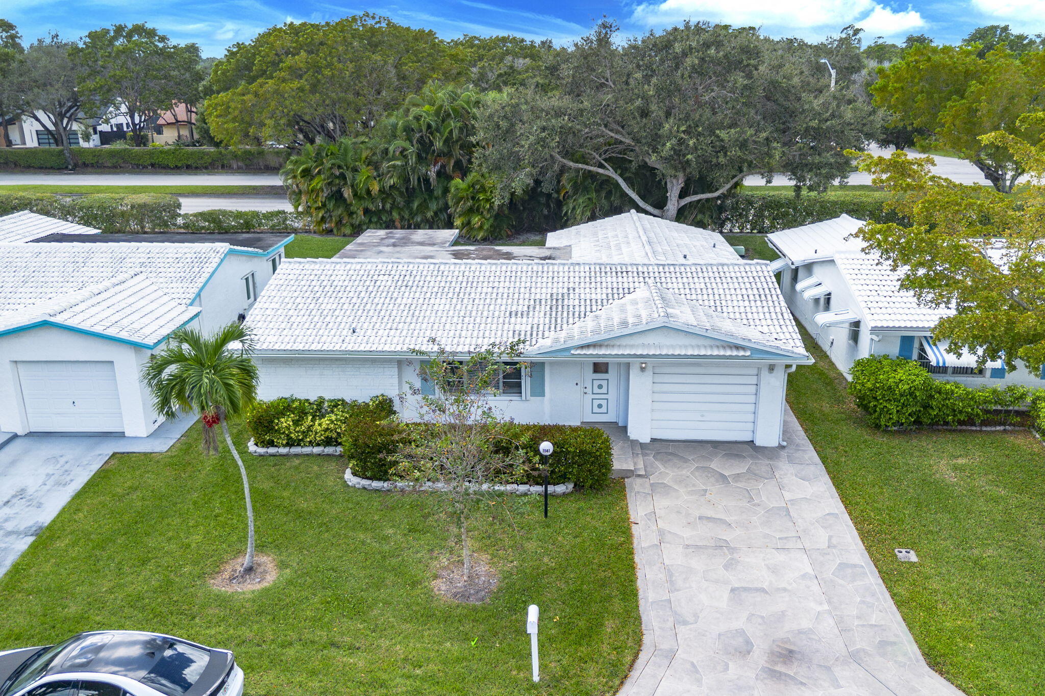 1141 Northwest 90th Way Plantation, FL 33322 - Photo 62 of 75 a house with green field in front of it