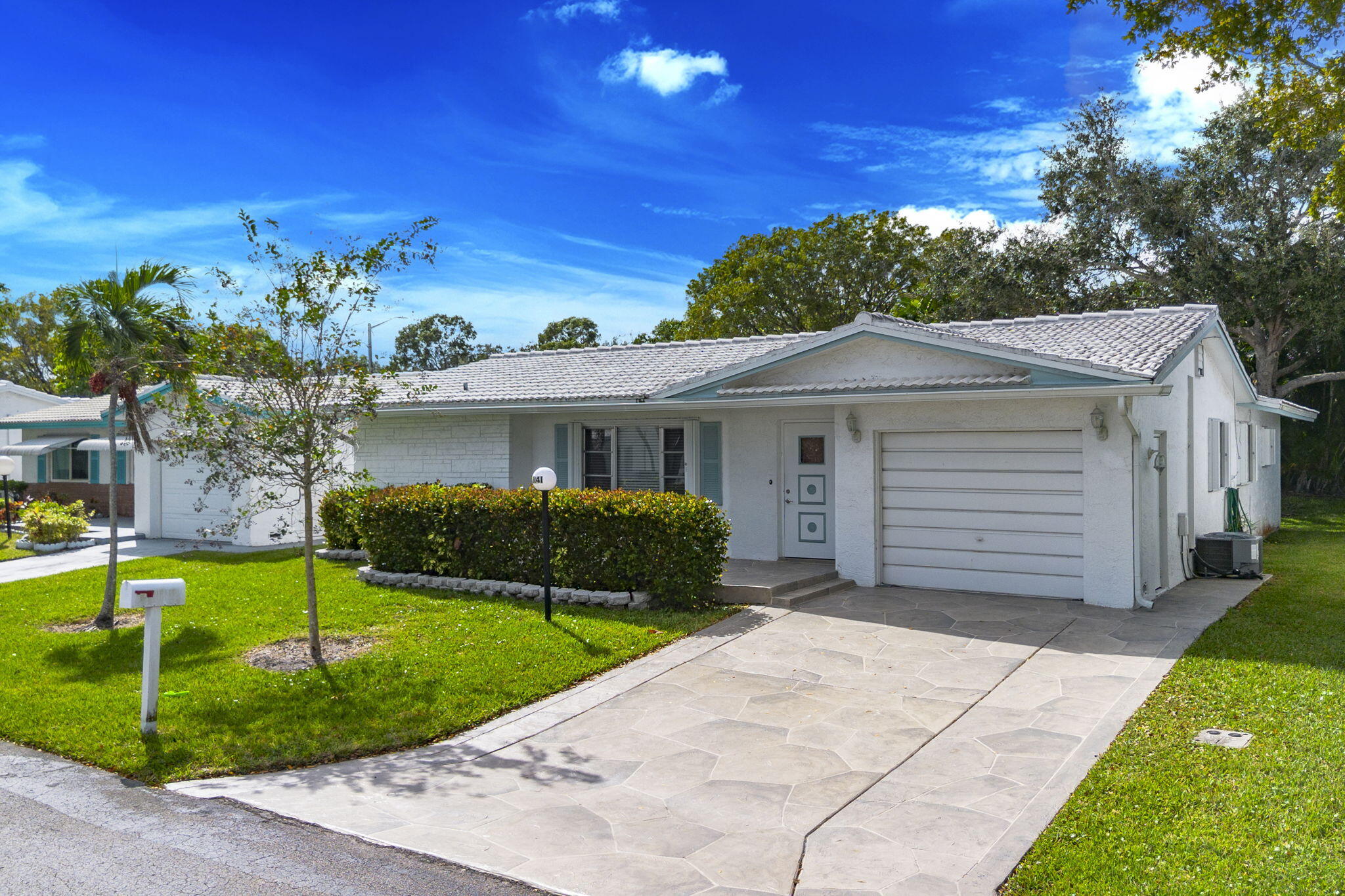 1141 Northwest 90th Way Plantation, FL 33322 - Photo 74 of 75 a front view of a house with a garden and yard