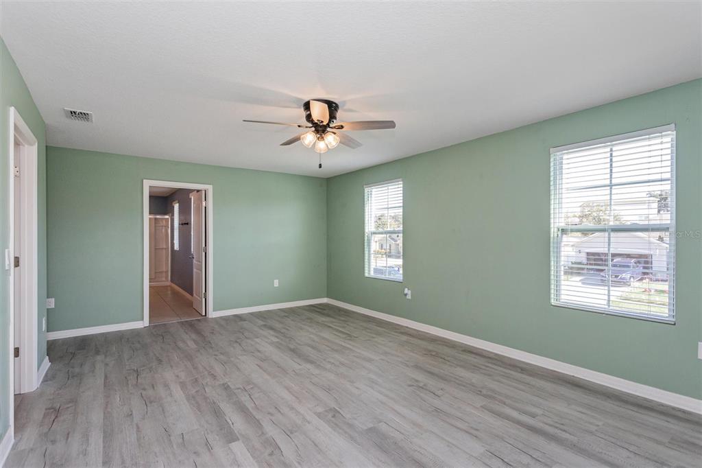 2470 Valhalla Drive Tavares, FL 32778 - Photo 15 of 26 a view of an empty room with window and wooden floor