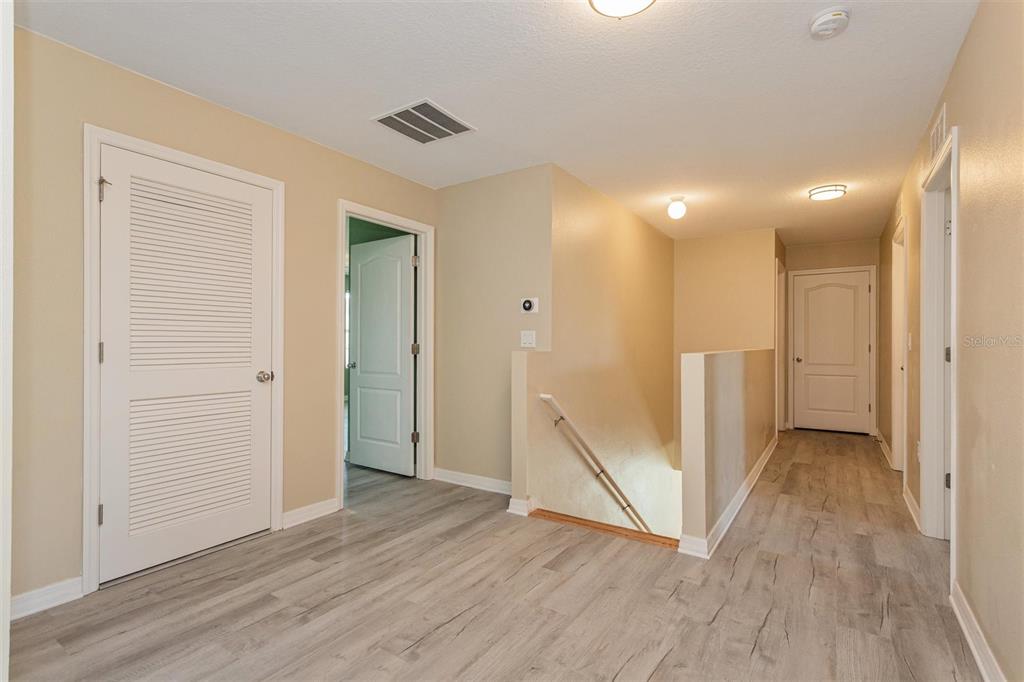 2470 Valhalla Drive Tavares, FL 32778 - Photo 23 of 26 an empty room with wooden floor and a ceiling fan