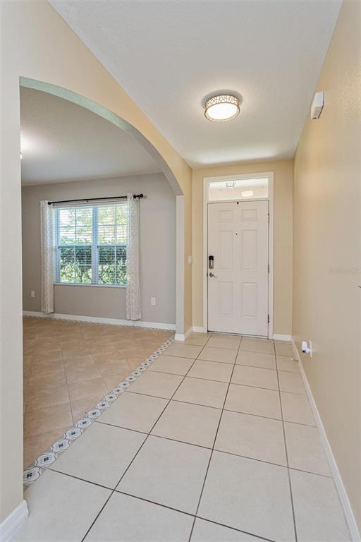 2470 Valhalla Drive Tavares, FL 32778 - Photo 4 of 26 a view of an empty room with a window