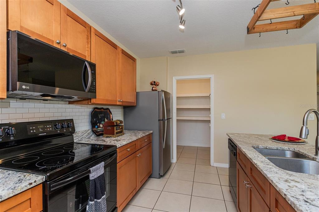 2470 Valhalla Drive Tavares, FL 32778 - Photo 10 of 26 a kitchen with a stove and a microwave
