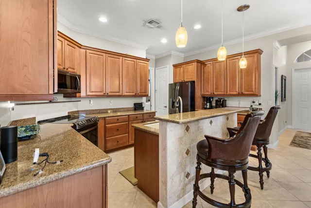 a view of swimming pool with outdoor seating and plants
