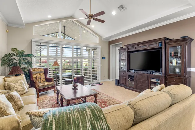 a front view of a house with a yard table and chairs