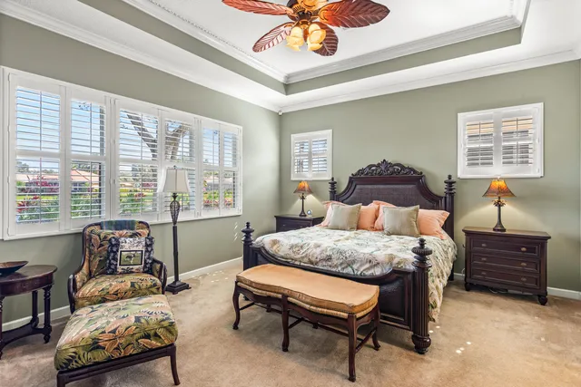 a front view of a house with a potted plant