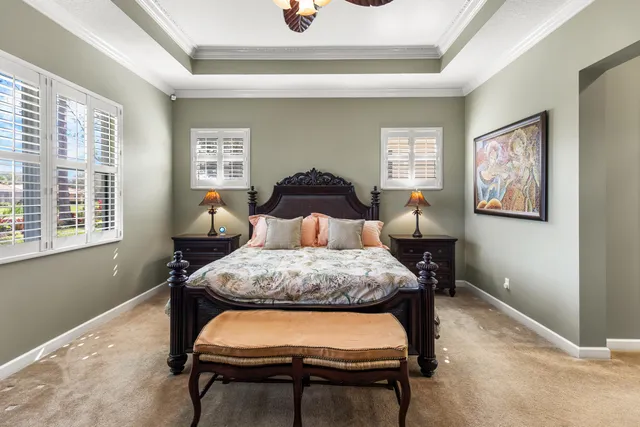 a view of a house with swimming pool and a big yard