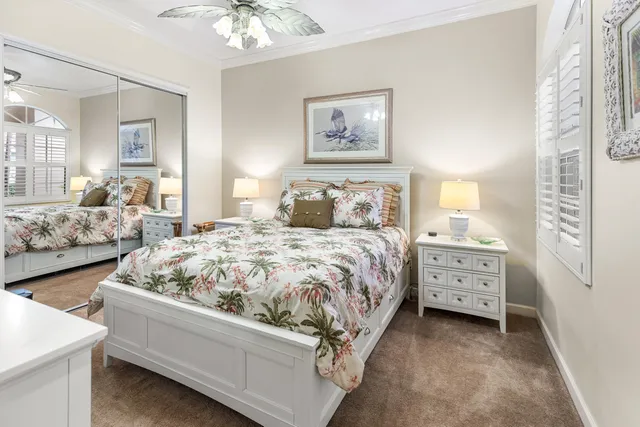 a living room with furniture tv and a large window