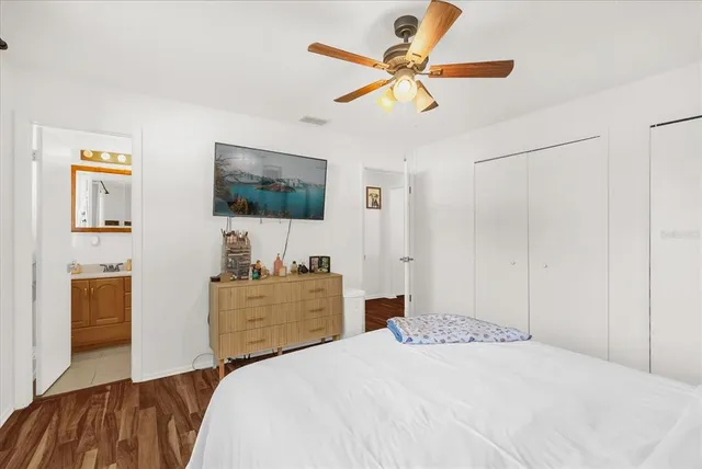 a bathroom with a sink vanity mirror and toilet