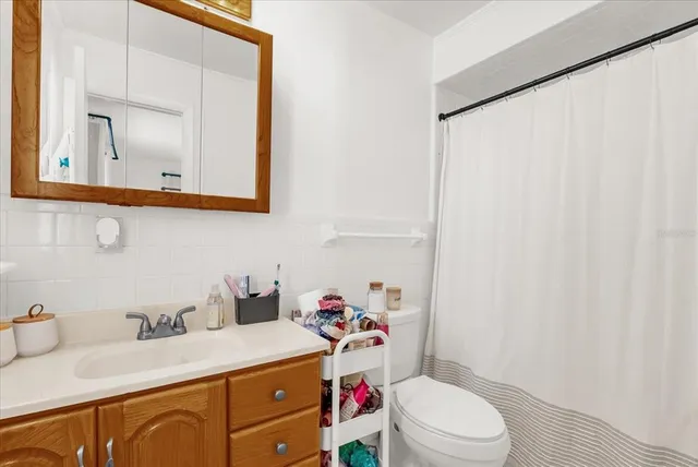 a kitchen with stainless steel appliances granite countertop a sink and a refrigerator