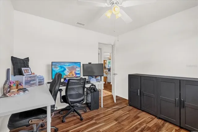 a view of a swimming pool with chairs
