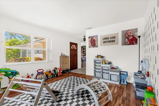 a bedroom with furniture and a window