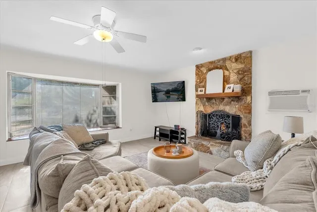 a living room with furniture and a large window
