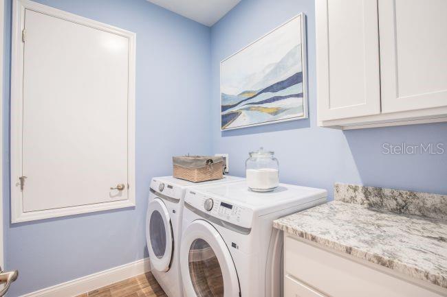16492 Crane Road Weeki Wachee, FL 34614 - Photo 19 of 24 a utility room with dryer and washer